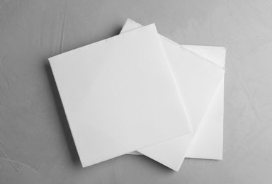 Photo of Clean napkins on light table, top view