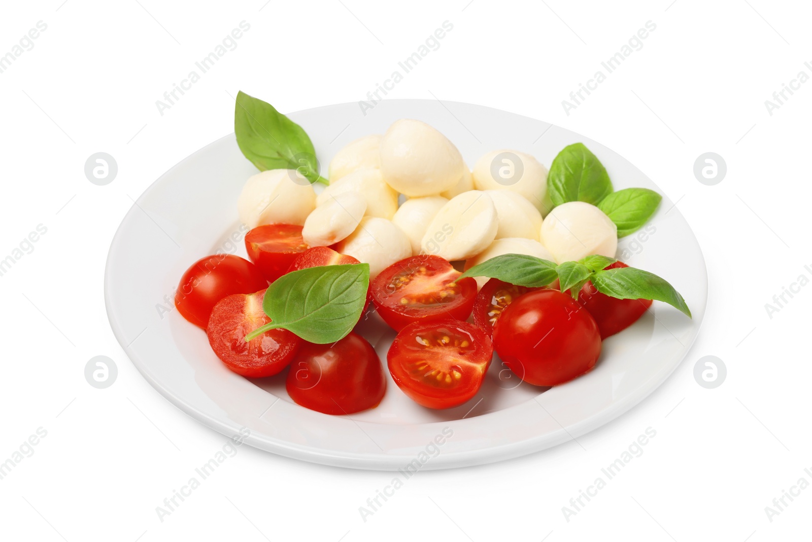 Photo of Plate of delicious Caprese salad with tomatoes, mozzarella and basil isolated on white