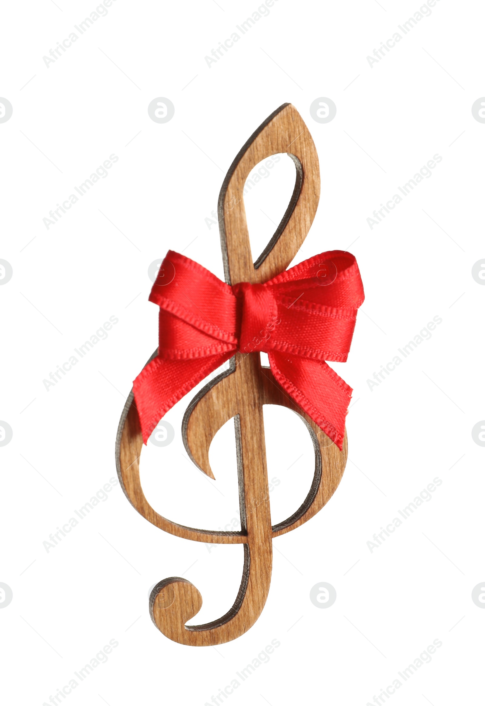 Photo of Wooden treble clef with bow on white background. Christmas music concept