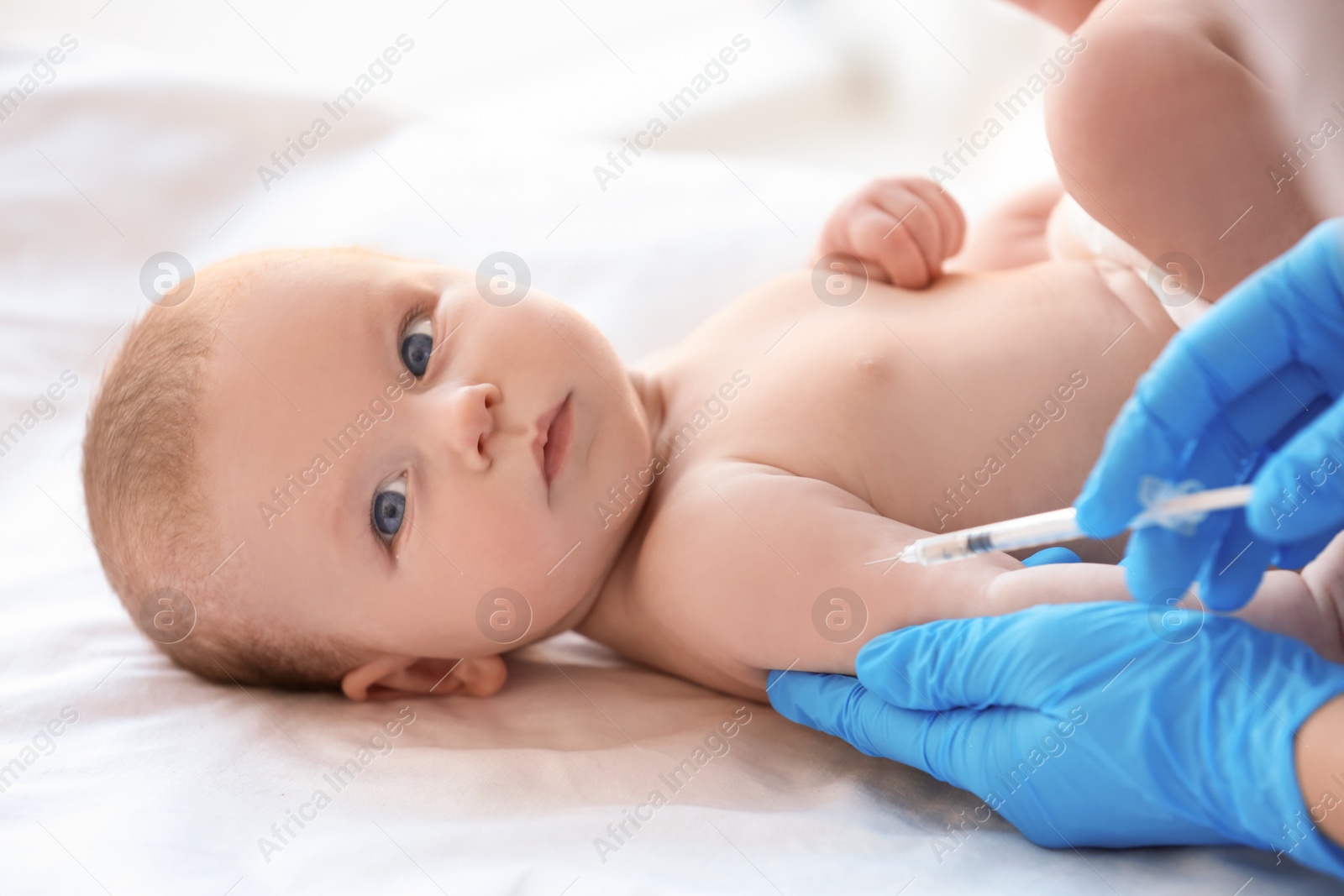 Photo of Doctor vaccinating baby in clinic