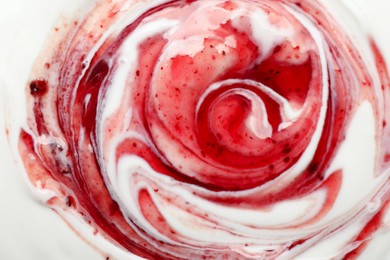 Photo of Tasty yoghurt with jam as background, top view