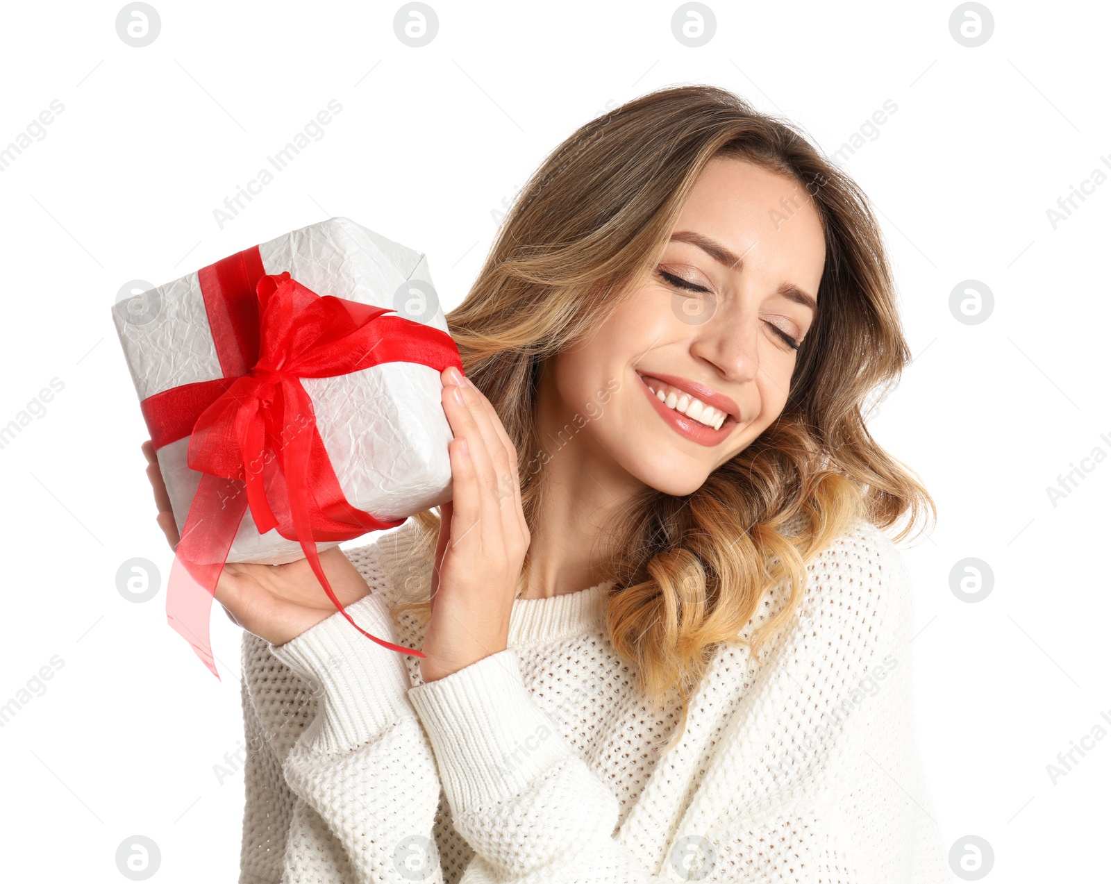 Photo of Beautiful young woman with Christmas present on white background