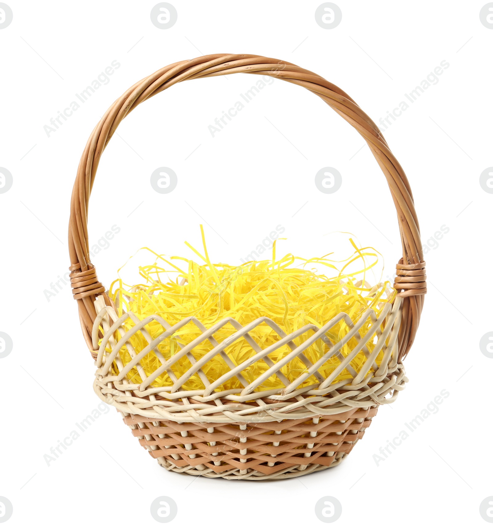 Photo of Wicker basket with yellow filler isolated on white. Easter item