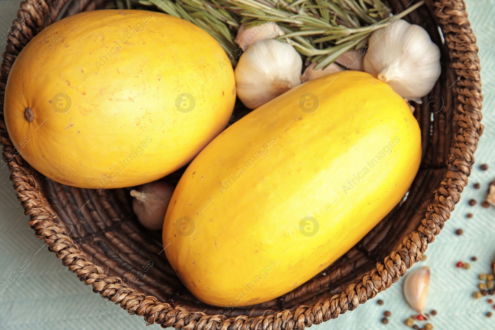 Photo of Basket with ripe spaghetti squashes on table, top view