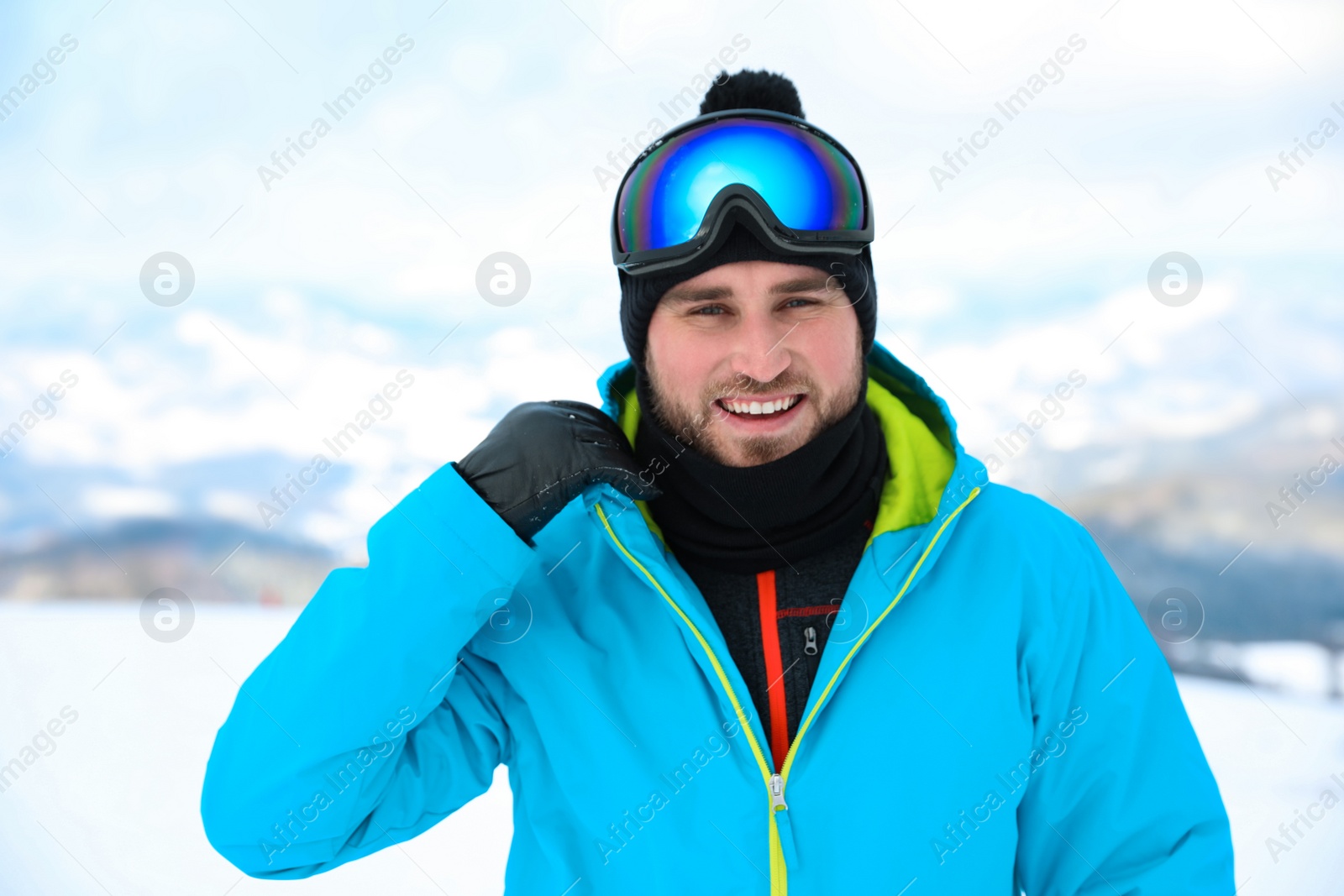 Photo of Young man at mountain resort. Winter vacation