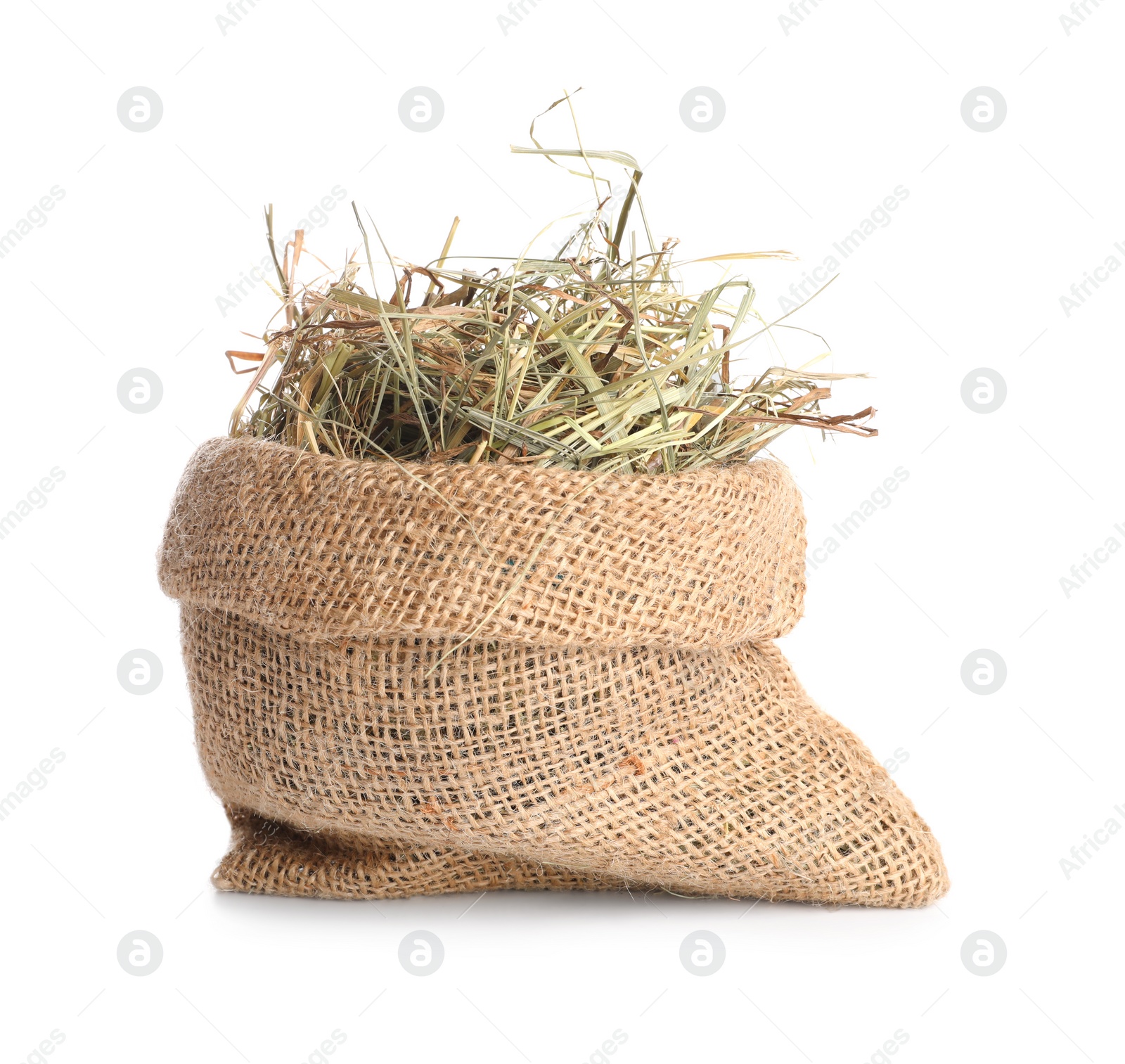 Photo of Dried hay in burlap sack isolated on white