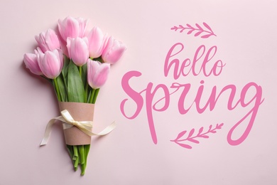 Image of Hello Spring. Beautiful tulips on pink background, top view