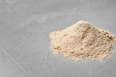 Photo of Pile of buckwheat flour on table