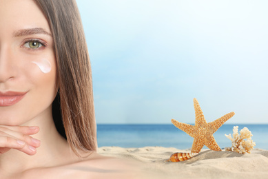 Image of Young woman with sun protection cream on face at beach