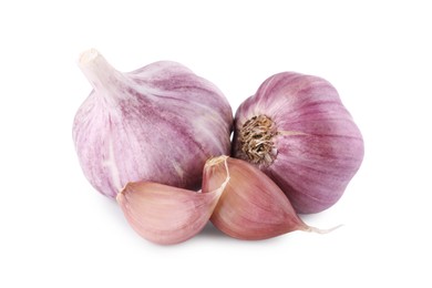 Photo of Fresh raw garlic heads and cloves isolated on white