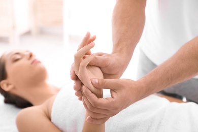 Young woman receiving massage in salon, closeup