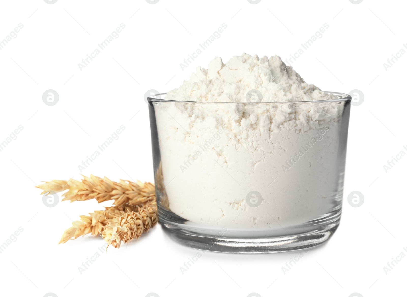 Photo of Bowl with flour and ears of wheat isolated on white