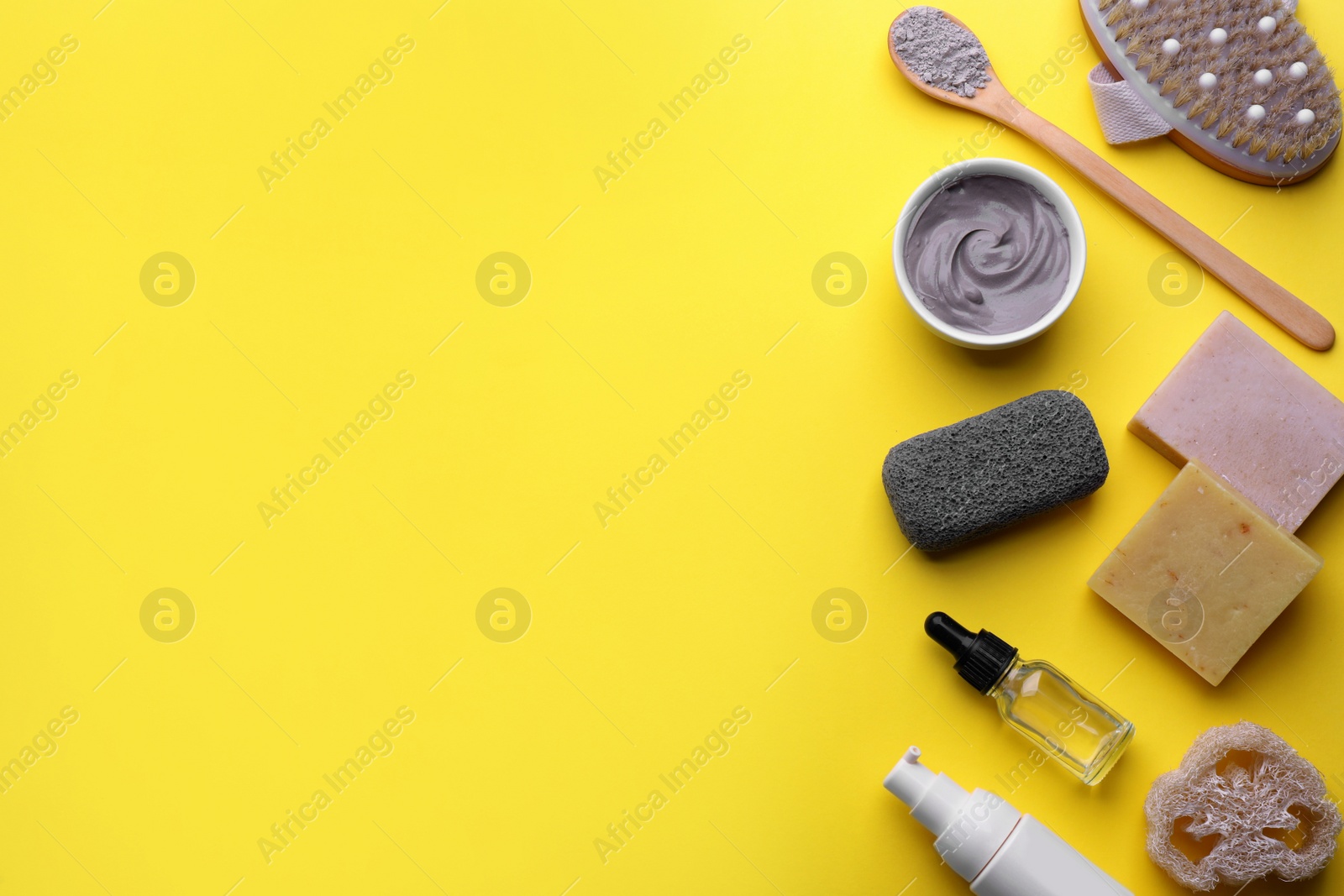 Photo of Flat lay composition with pumice stone on yellow background. Space for text