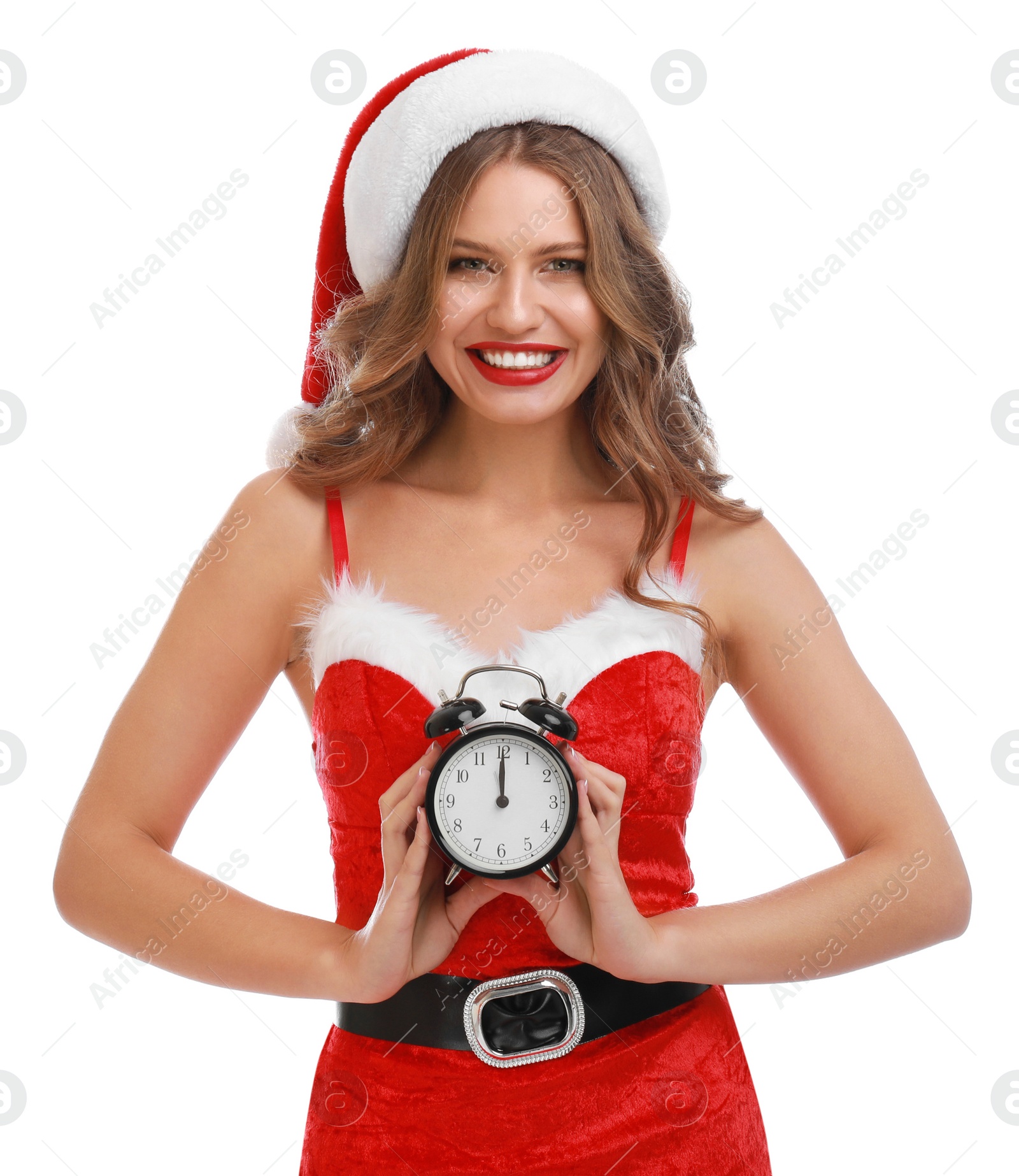 Photo of Beautiful Santa girl with alarm clock on white background. Christmas celebration