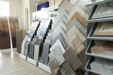 Photo of Assortment of tiles in store. Many different samples indoors