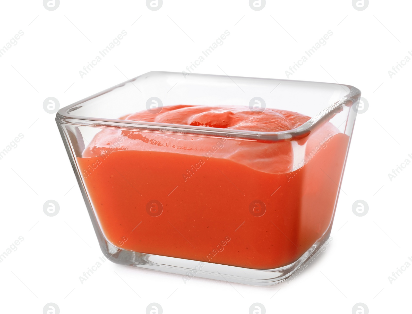 Photo of Tasty tomato sauce in glass bowl isolated on white