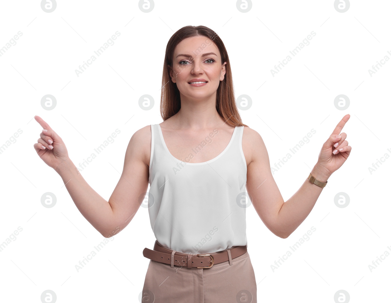 Photo of Beautiful businesswoman pointing at something against white background