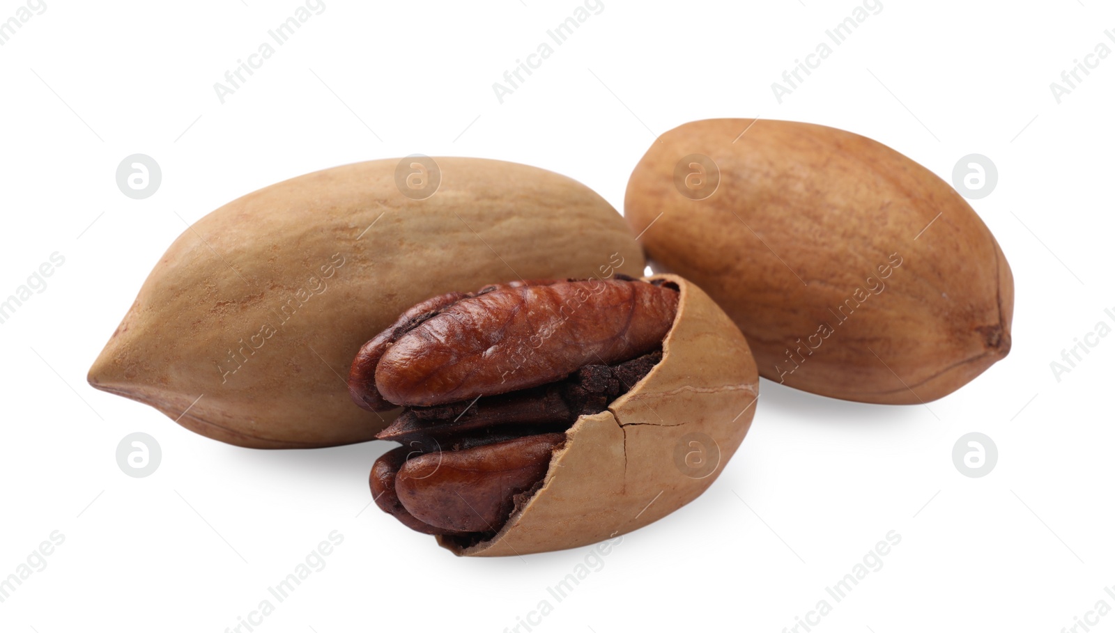 Photo of Three tasty pecan nuts isolated on white