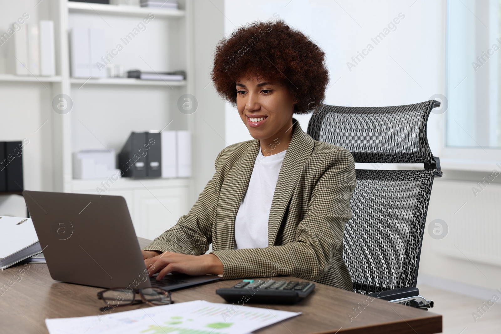 Photo of Professional accountant working on laptop in office