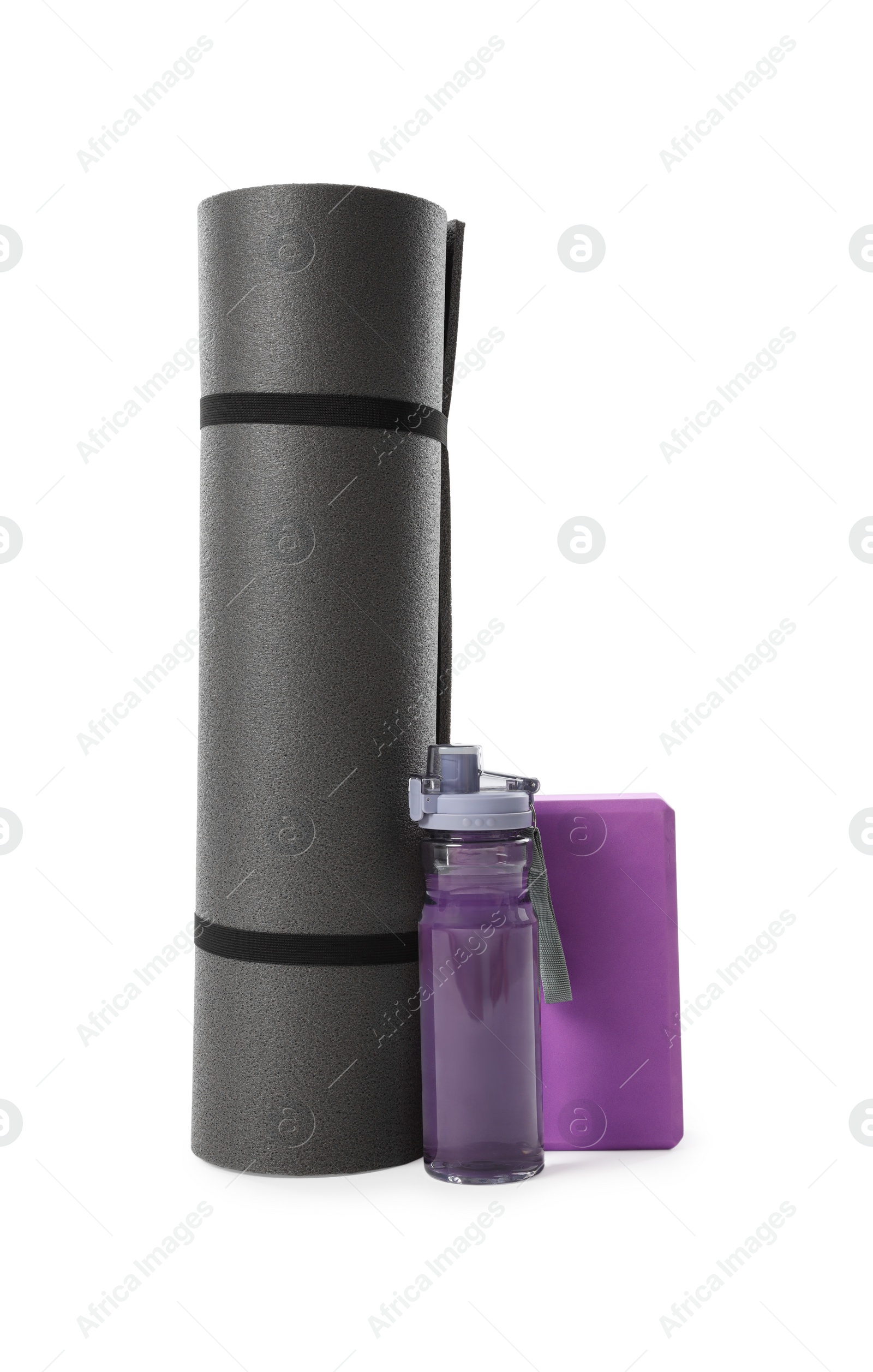 Photo of Grey exercise mat, yoga block and bottle of water isolated on white