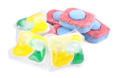 Photo of Dishwasher detergent pods and tablets on white background