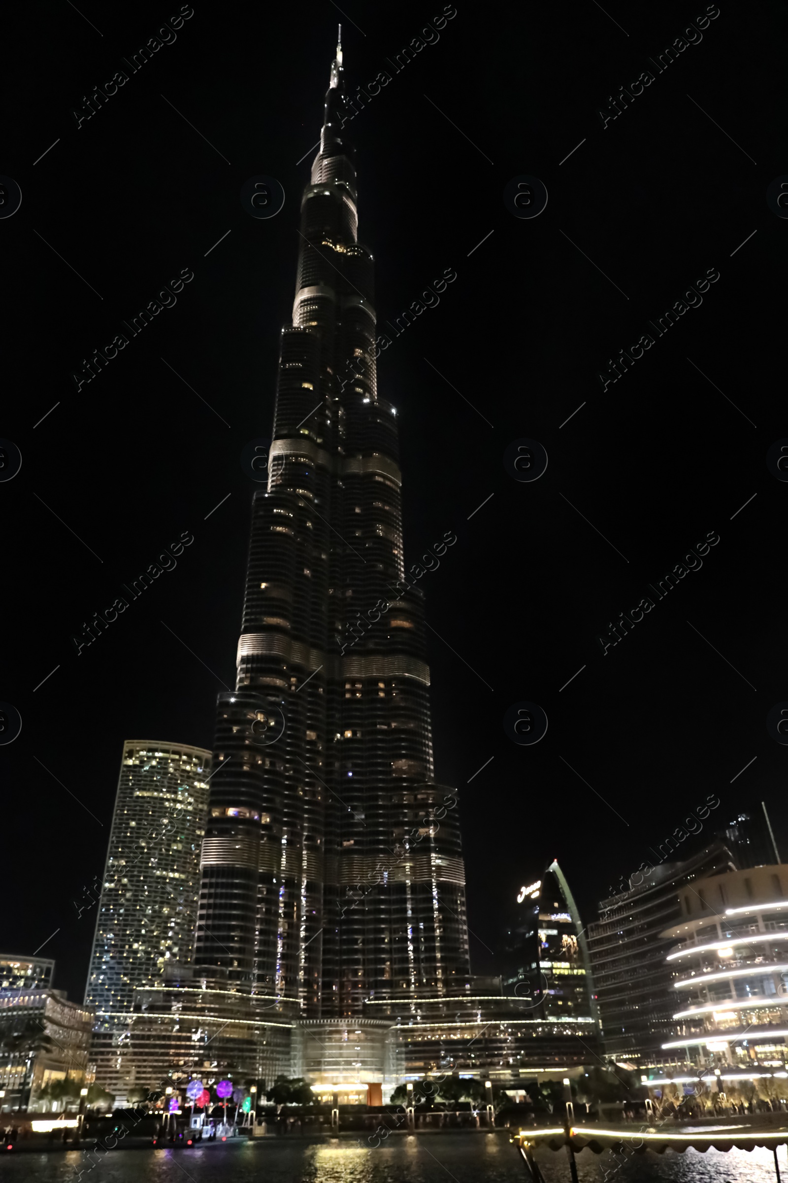Photo of DUBAI, UNITED ARAB EMIRATES - NOVEMBER 04, 2018: Night cityscape with world tallest building Burj Khalifa