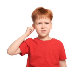 Photo of Little boy suffering from ear pain on white background