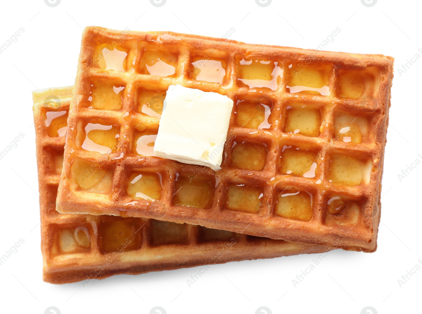 Photo of Delicious Belgian waffles with honey and butter isolated on white, top view