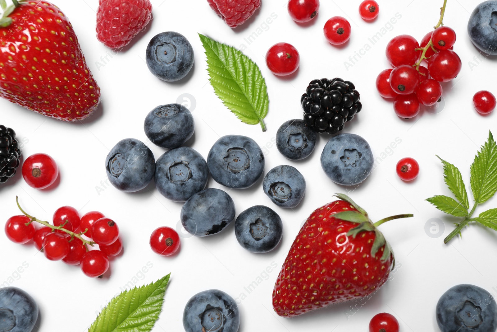 Photo of Mix of fresh berries on white background, flat lay