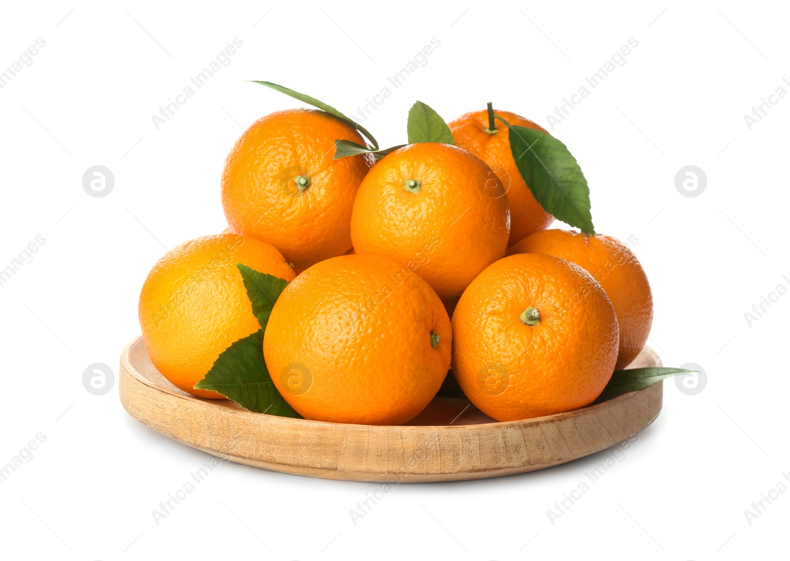 Photo of Fresh ripe oranges with green leaves in wooden plate isolated on white