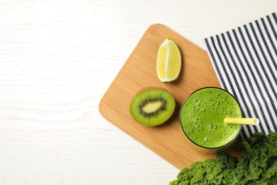 Photo of Flat lay composition with kale smoothie on white wooden table, space for text