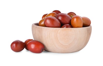 Photo of Ripe red dates in wooden bowl on white background