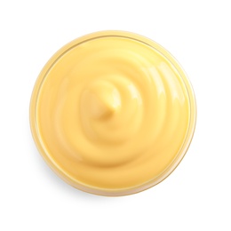 Photo of Delicious cheese sauce in bowl on white background, top view