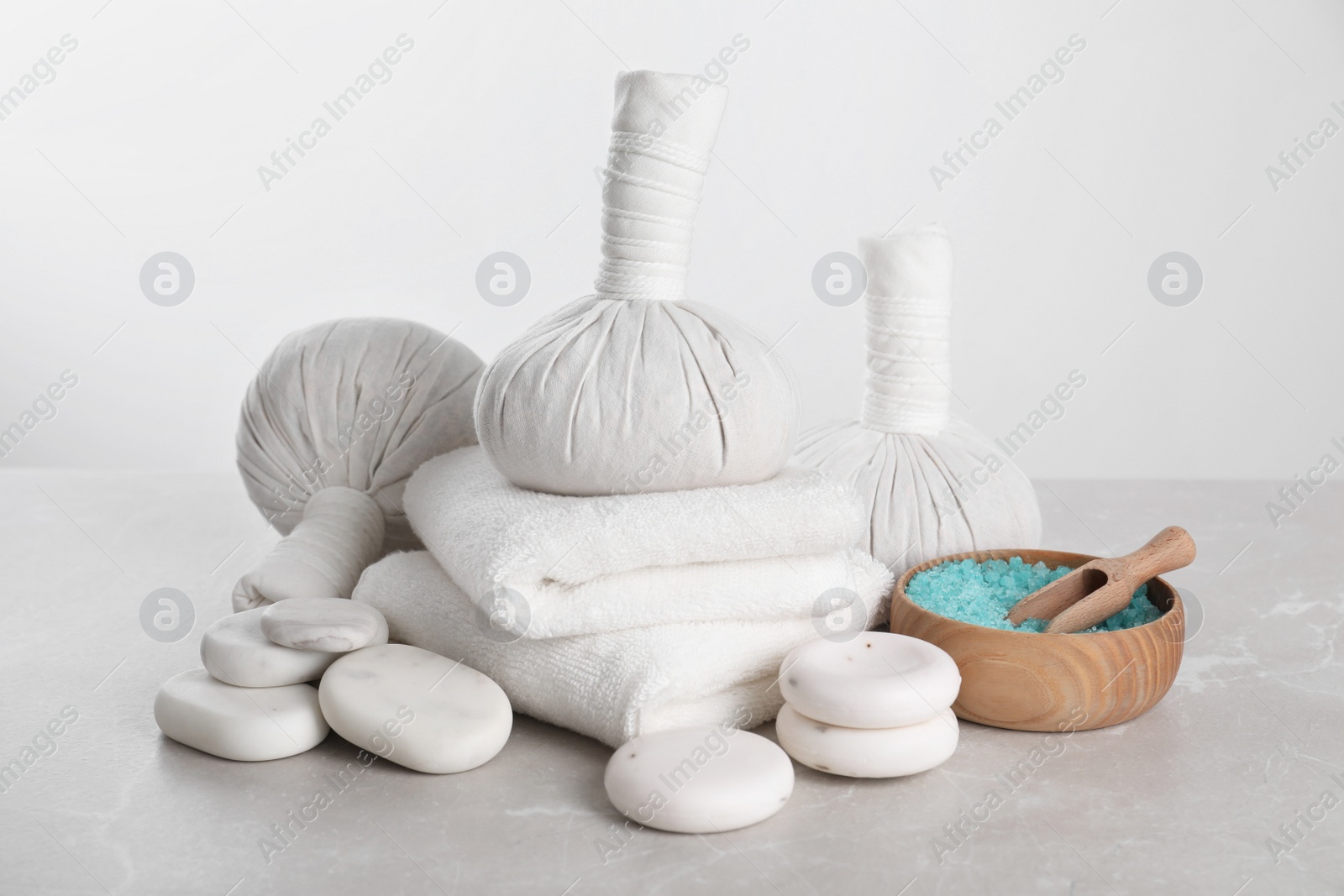 Photo of Spa composition with care products on light grey marble table
