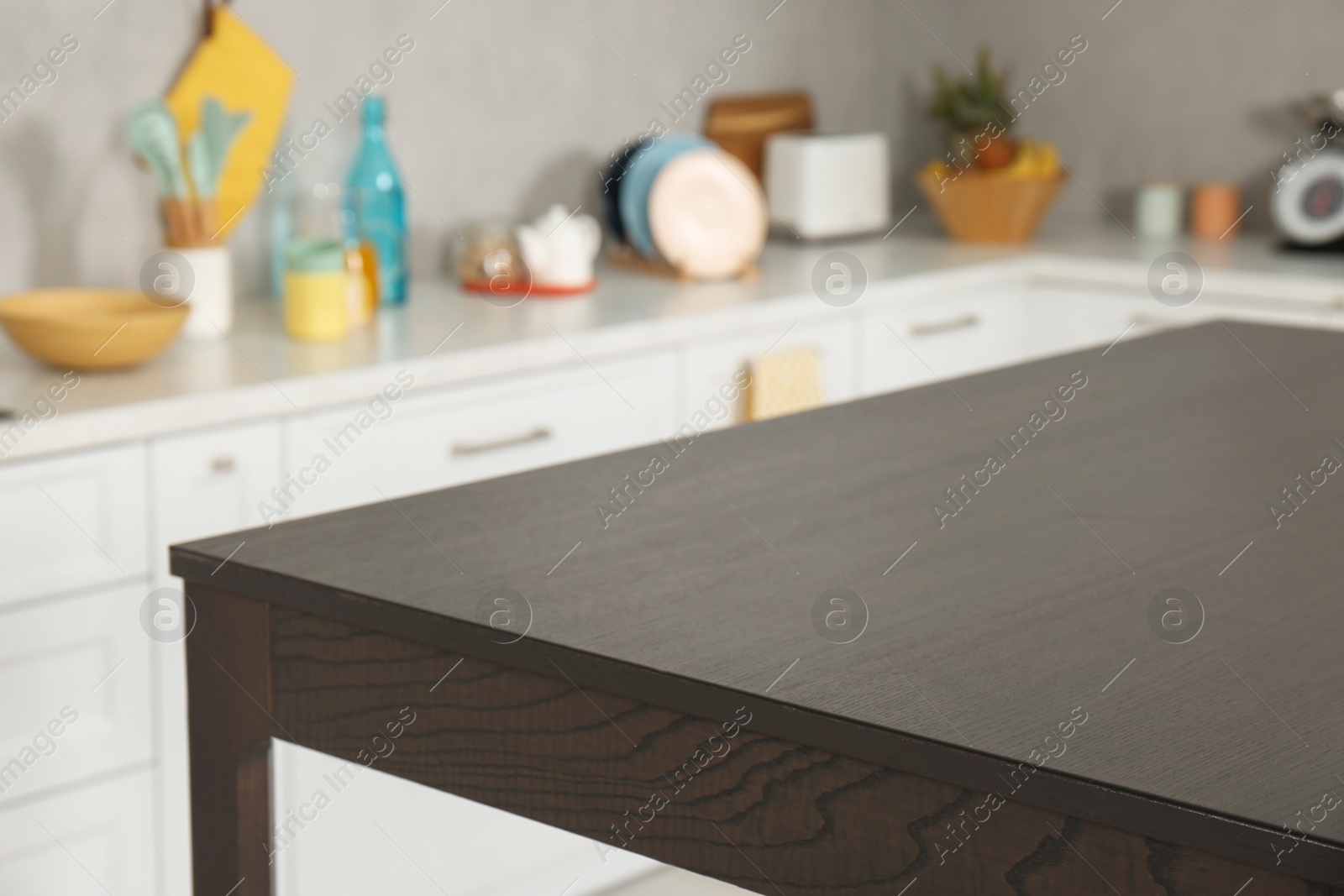 Photo of Stylish wooden table in kitchen. Interior design