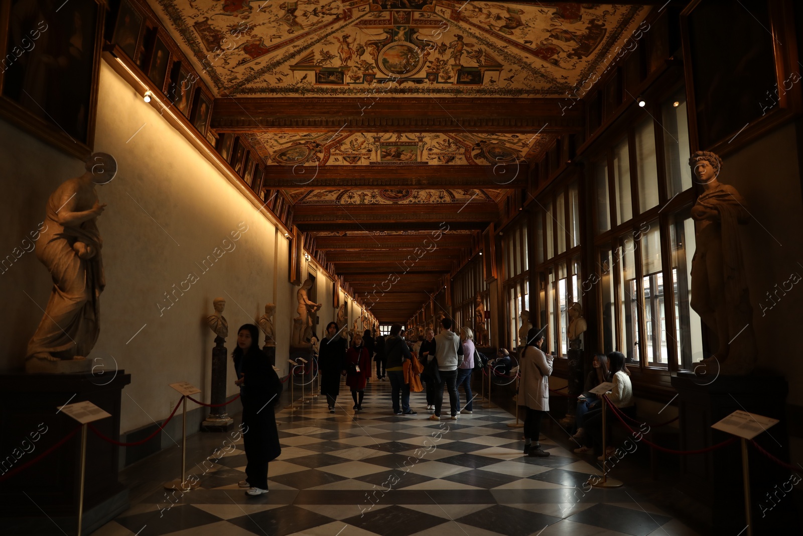 Photo of Florence, Italy - February 8, 2024: Visitors admiring different famous sculptures at Uffizi gallery