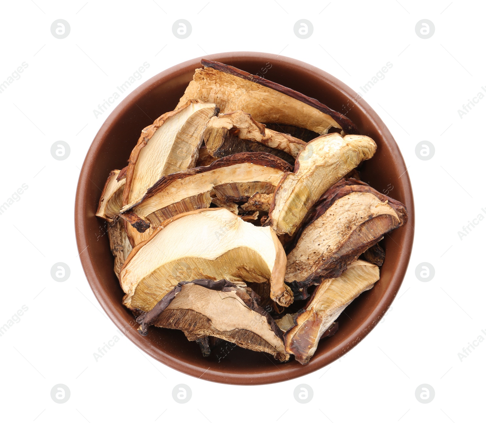 Photo of Bowl of dried mushrooms isolated on white, top view