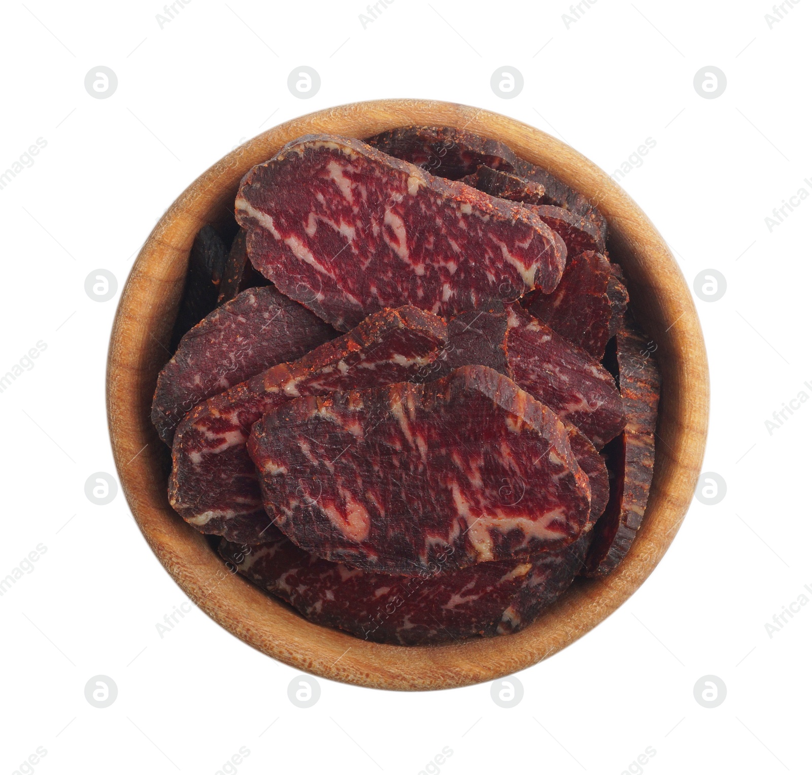 Photo of Delicious beef jerky in wooden bowl isolated on white, top view