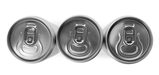 Top view of aluminum cans with beverage on white background