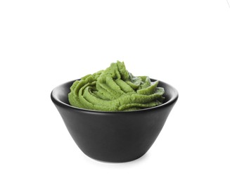 Photo of Bowl with swirl of wasabi paste isolated on white