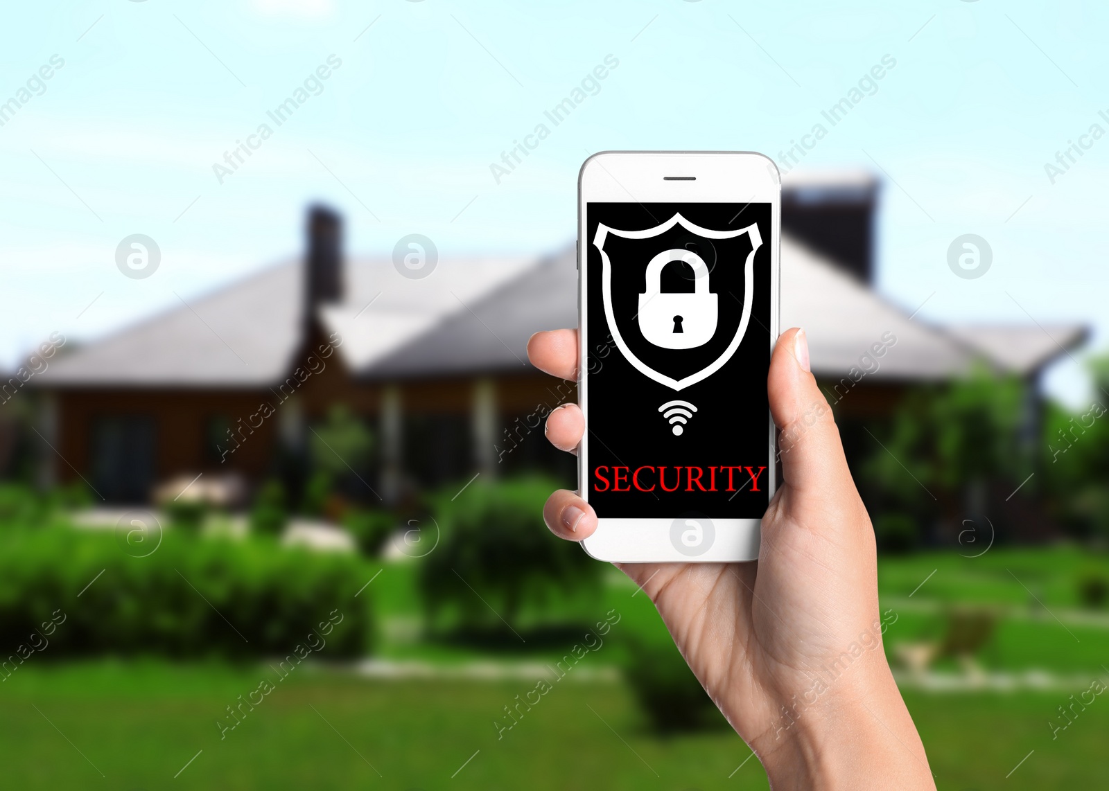 Image of Alarm system. Woman using phone outdoors, space for text