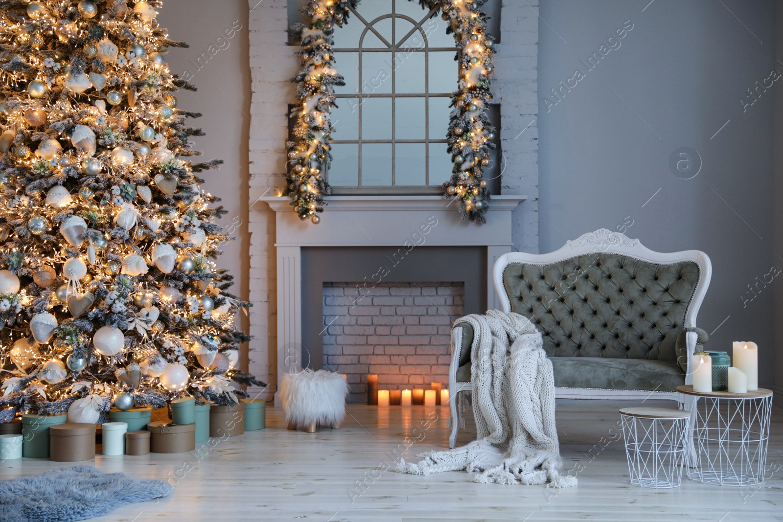 Photo of Festive room interior with stylish furniture and beautiful Christmas tree