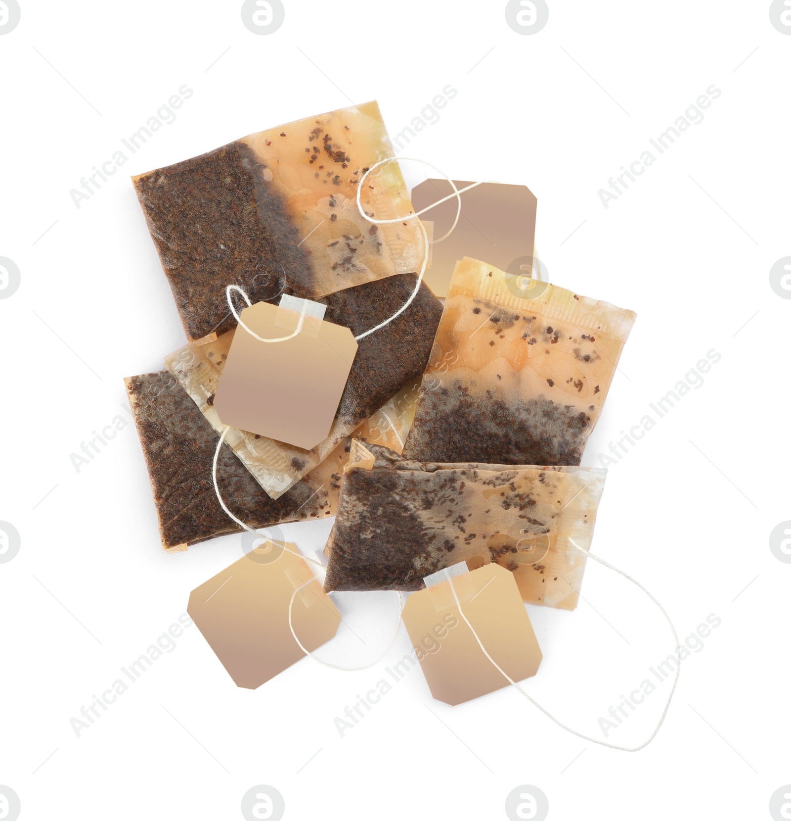 Photo of Used tea bags on white background, top view