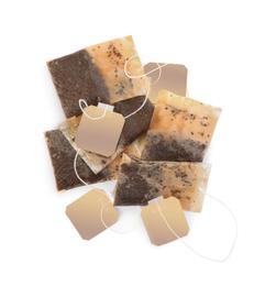 Photo of Used tea bags on white background, top view