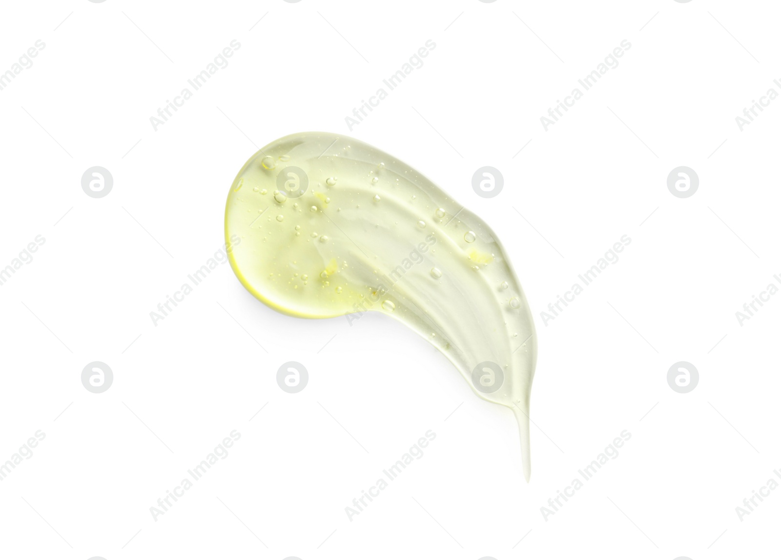 Photo of Smear of yellow ointment on white background, top view