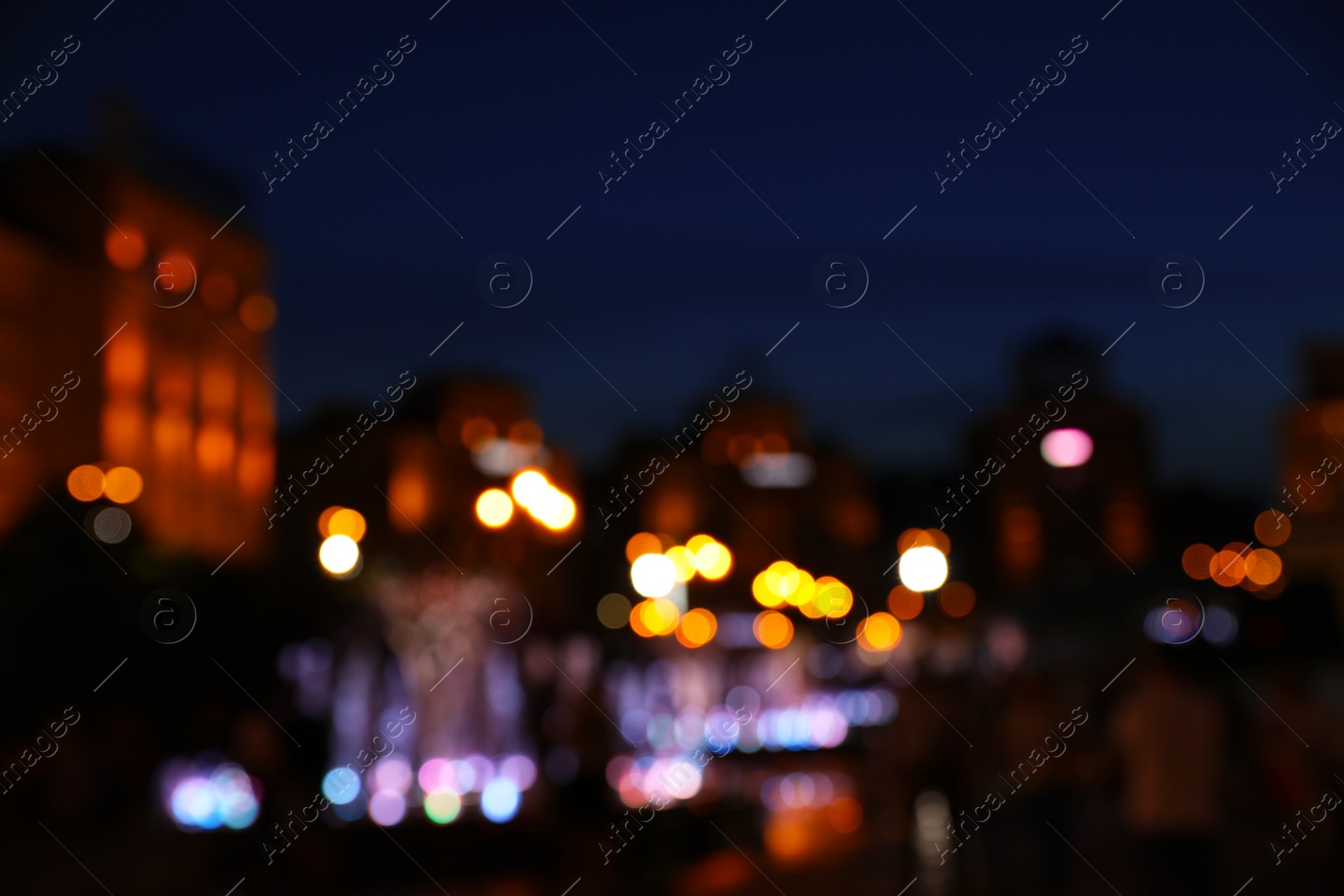 Photo of Blurred view of beautiful city at night. Bokeh effect