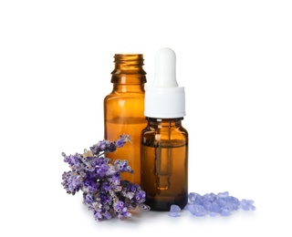 Bottles with aromatic lavender oil on white background