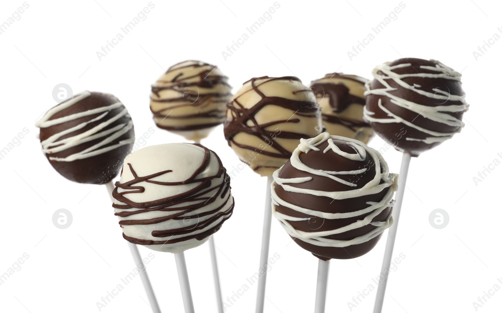 Photo of Tasty cake pops decorated with chocolate isolated on white