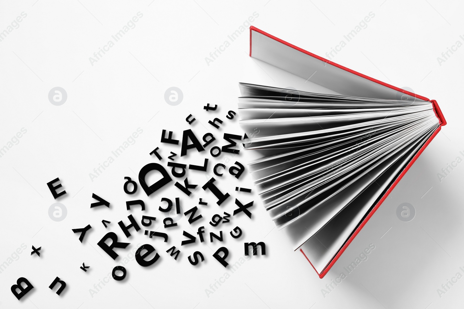 Image of Open book with letters on white background, top view. Dyslexia concept