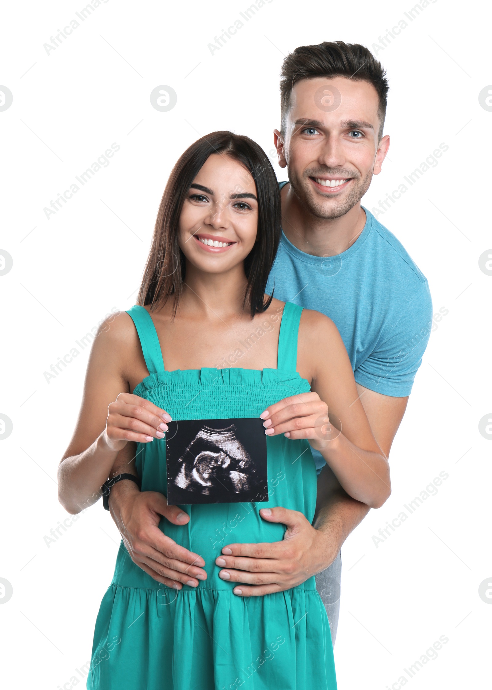 Photo of Happy young family with ultrasound picture on white background